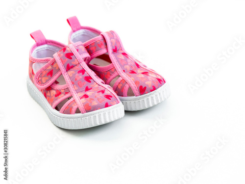 Cute pink baby girl shoes isolated on white background/ Top view