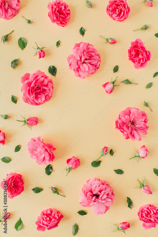 Pink rose flowers pattern on yellow background with blank mockup copy space frame. Pink rose flowers pattern on yellow background with blank mockup copy space frame.