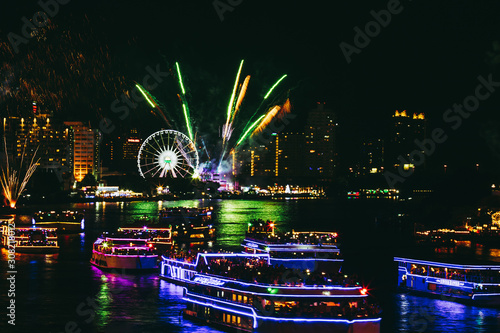 Landscape photo of firework for New Year 2019 celebration on Chao Phraya River with people or traveller on boat at Bangkok Thailand.