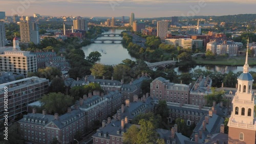 Aerial:flying over Harvard University & Charles River at sunrise. Boston, Massachusetts, USA.  photo