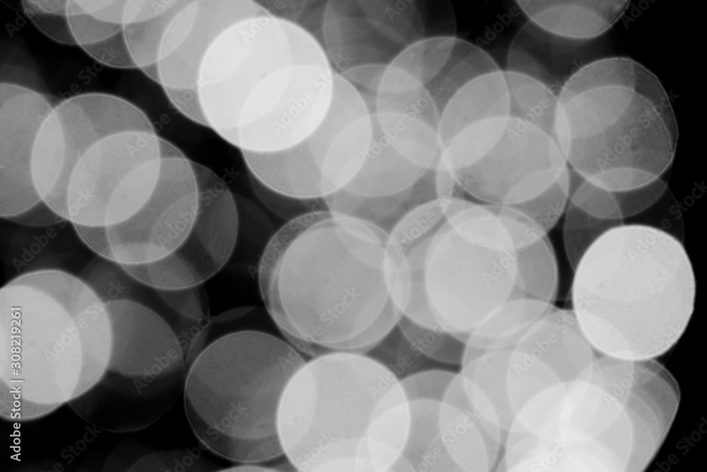 Blurry black and white bokeh glowing in the dark Blurry black and white bokeh glowing in the dark