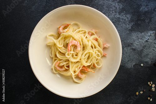 pasta shrimp (spaghetti cream sauce and seafood prawn) menu concept. food background. top view. copy space