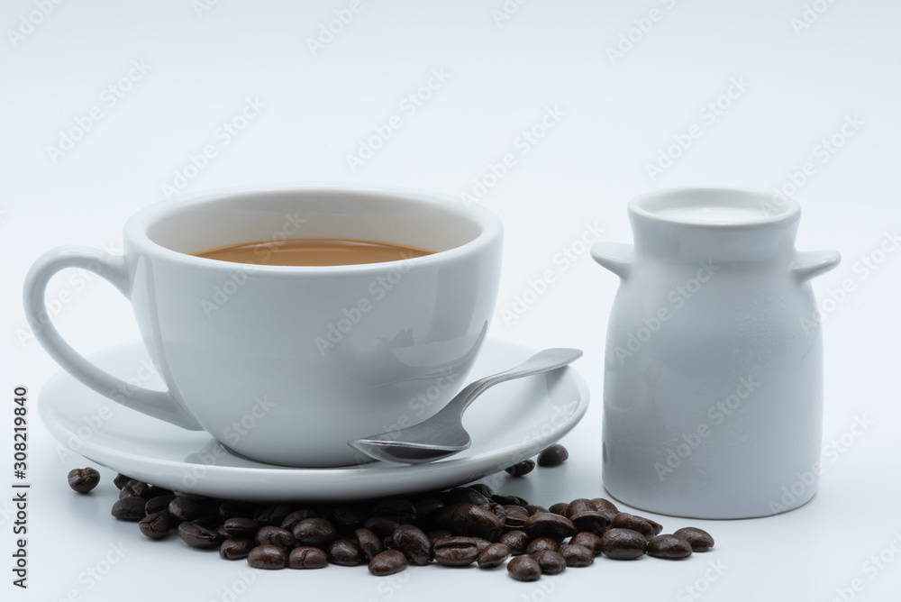 Fototapeta premium Milk coffee in a ceramic cup on a white background