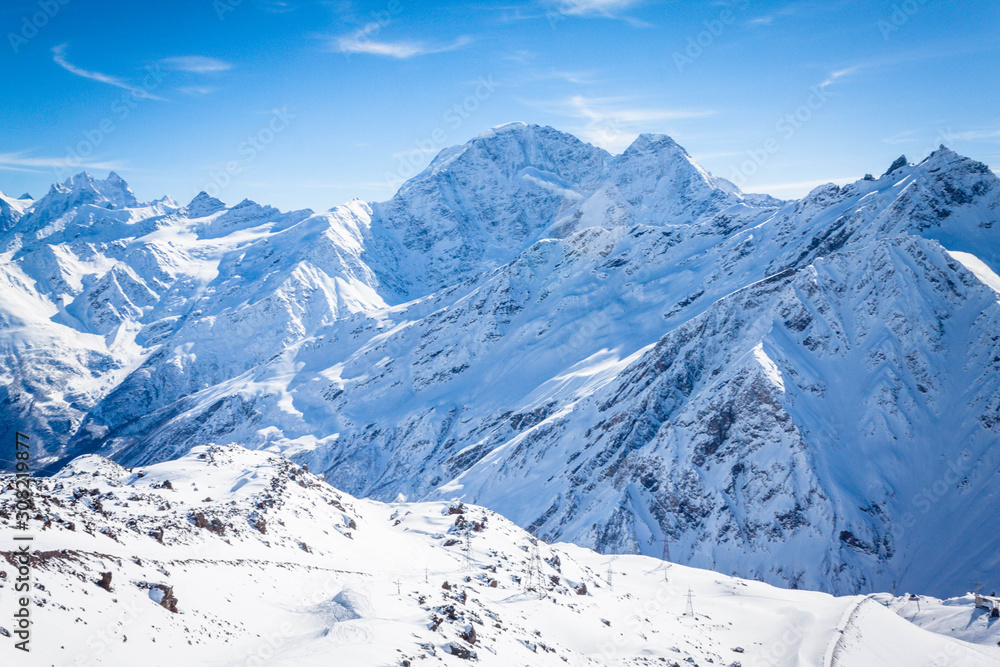 Winter panoramic view of the snowy high mountains of Elbrus in the Russia Winter panoramic view of the snowy high mountains of Elbrus in the Russia