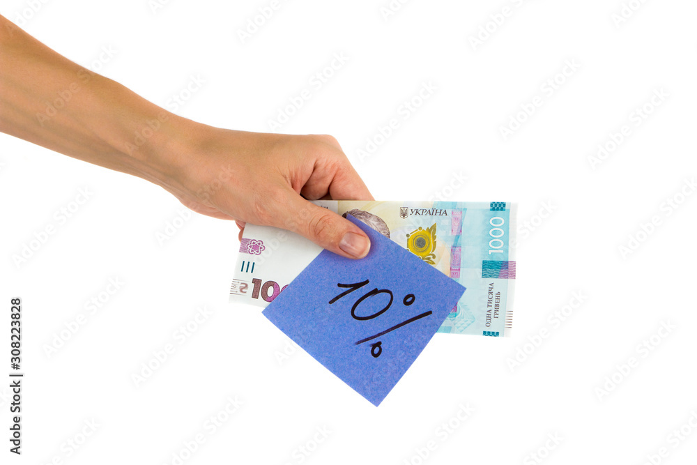 Thousand hryvnias and sticker with different financial signs and symbols in the hand, isolated Thousand hryvnias and sticker with different financial signs and symbols in the hand, isolated