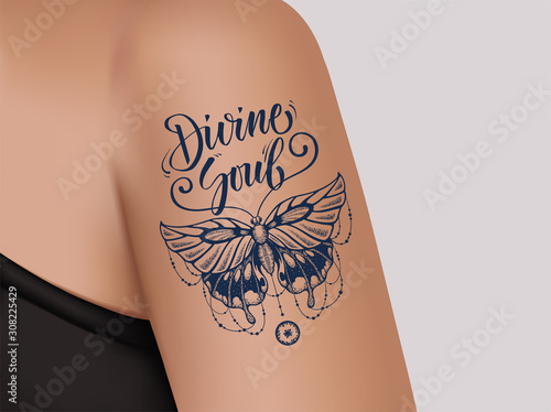 Butterfly tattoo on female shoulder. Divine Soul.
