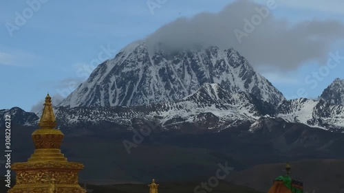 Buddhist Temple on the top of a hill, Tibetan Village of Bamei situated in the grasslands of Sichuan Province, China. (time-lapse) photo