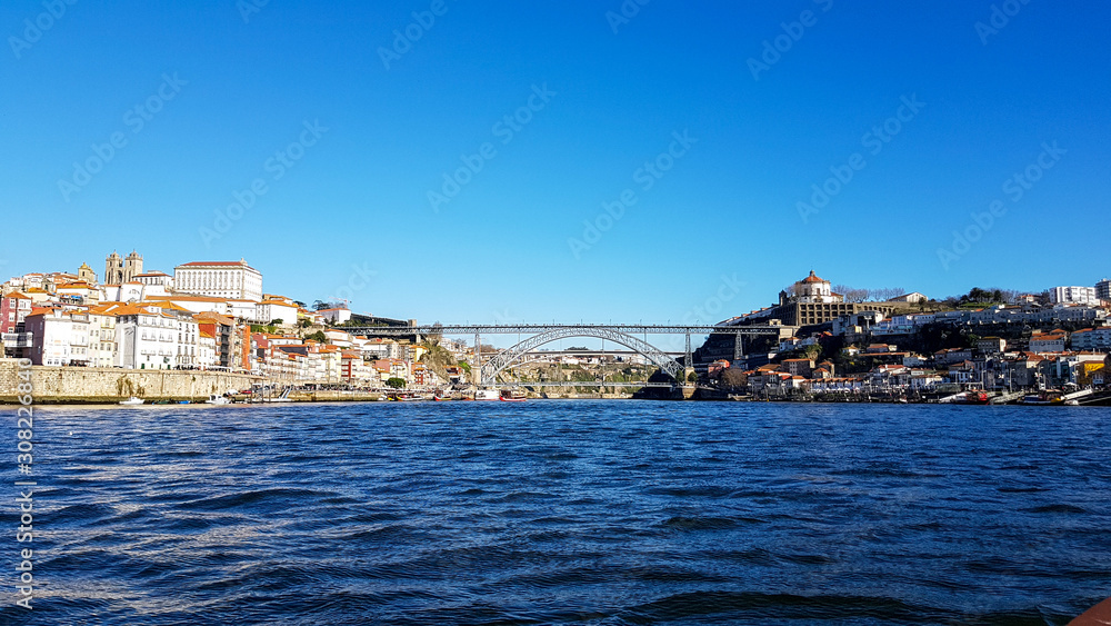 Porto Bridge with blue sky and the river