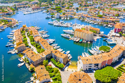 View Of Colorful Houses And Boats In Port Grimaud During Summer Day-Port Grimaud, France photo