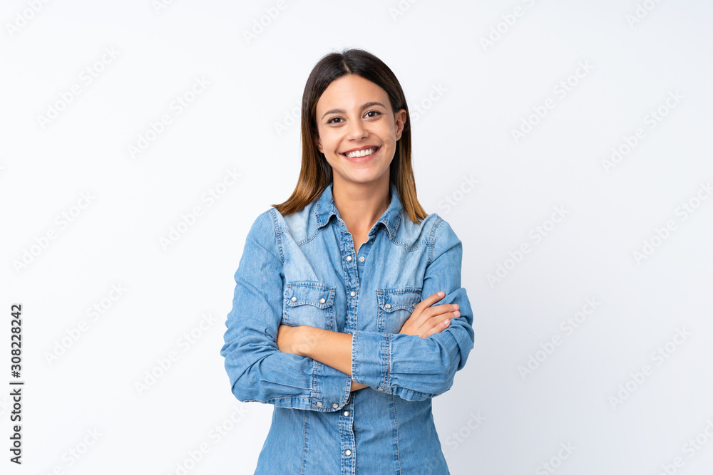 Young woman over isolated white background keeping the arms crossed in frontal position Young woman over isolated white background keeping the arms crossed in frontal position