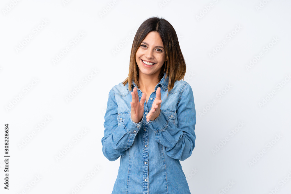 Young woman over isolated white background applauding after presentation in a conference Young woman over isolated white background applauding after presentation in a conference
