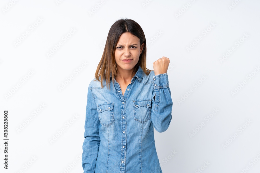 Young woman over isolated white background with angry gesture Young woman over isolated white background with angry gesture