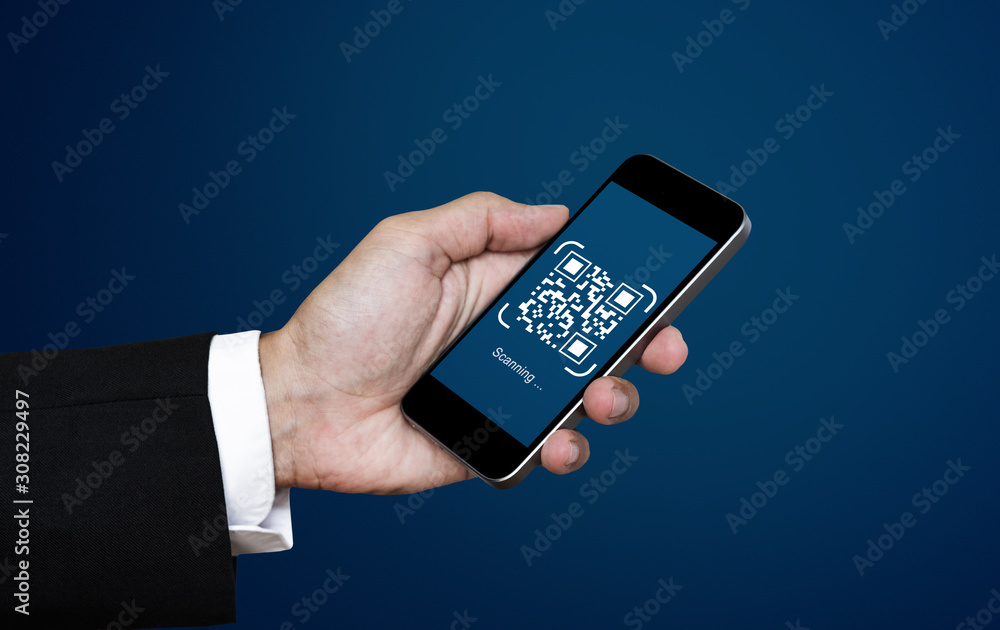 QR code scanning payment and verification. Businessman holding mobile smart phone scan QR code QR code scanning payment and verification. Businessman holding mobile smart phone scan QR code