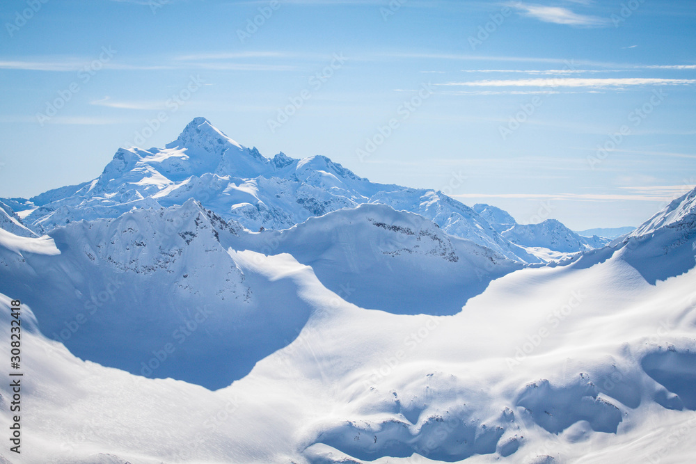 Magnificent view of the snow-white tall mighty mountains Elbrus, ski resort, the Republic of Kabardino-Balkaria, Russia