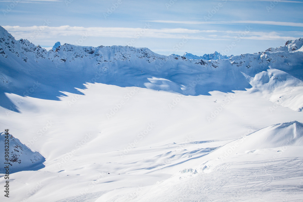 Magnificent view of the snow-white tall mighty mountains Elbrus, ski resort, the Republic of Kabardino-Balkaria, Russia