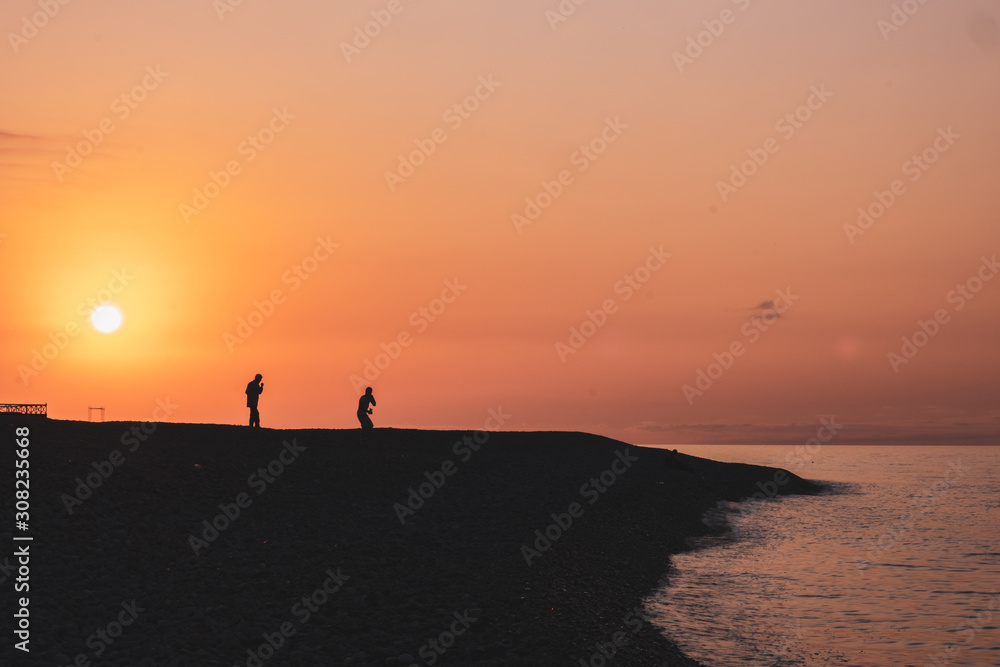 silhouette of man on beach at sunset, batumi, Black sea