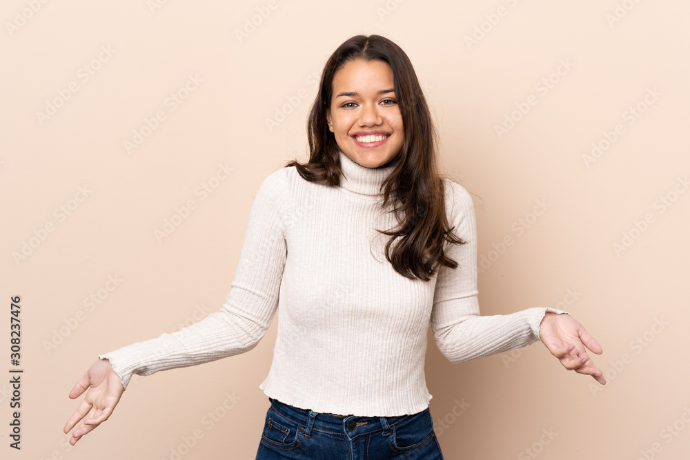 Young Colombian girl over isolated background smiling Young Colombian girl over isolated background smiling