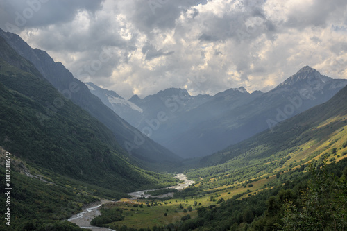Panorama view on mountains with river scene in national park of Dombay