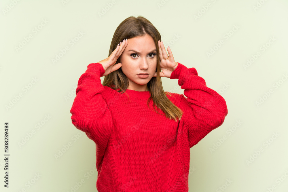Teenager girl over isolated green background unhappy and frustrated with something. Negative facial expression Teenager girl over isolated green background unhappy and frustrated with something. Negative facial expression