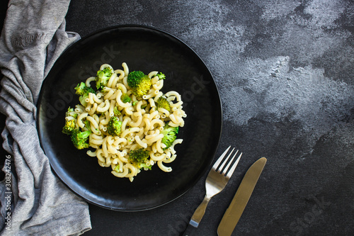 pasta broccoli, vegetarian dish (main course with vegetables Cavatappi, Elbow) menu concept. food background. top view. copy space