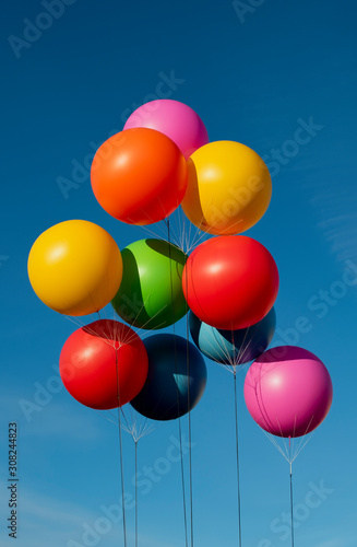 Different colored balloons in the sky