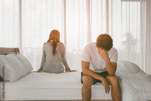 Unhappy couple with problem relationship appear on the bedroom background textures concept.