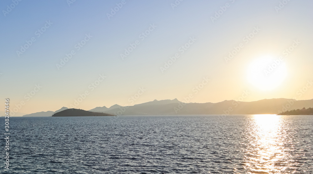 Beautiful sunset on the Mediterranean Sea with islands and mountains