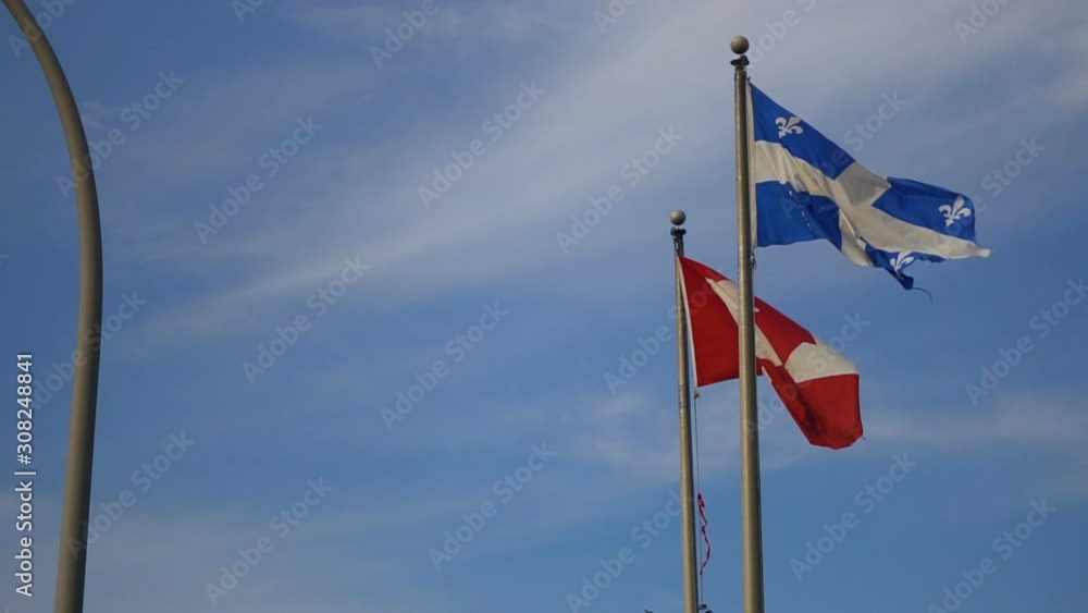 Quebec & Canadian Flags Waving in Slow Motion Quebec & Canadian Flags Waving in Slow Motion