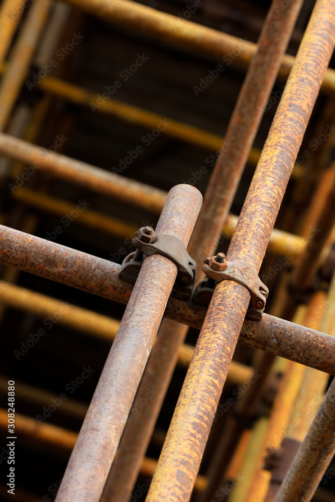 Scaffolding steel pipe at a construction site Scaffolding steel pipe at a construction site