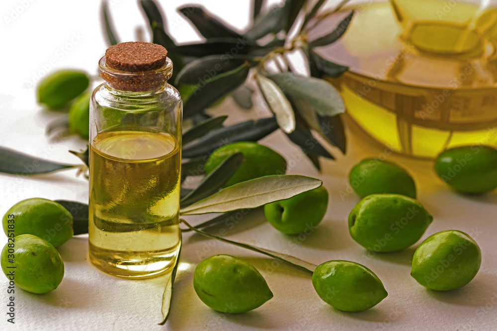 Olive oil and olive oil on a white background. Olive oil and olive oil on a white background.