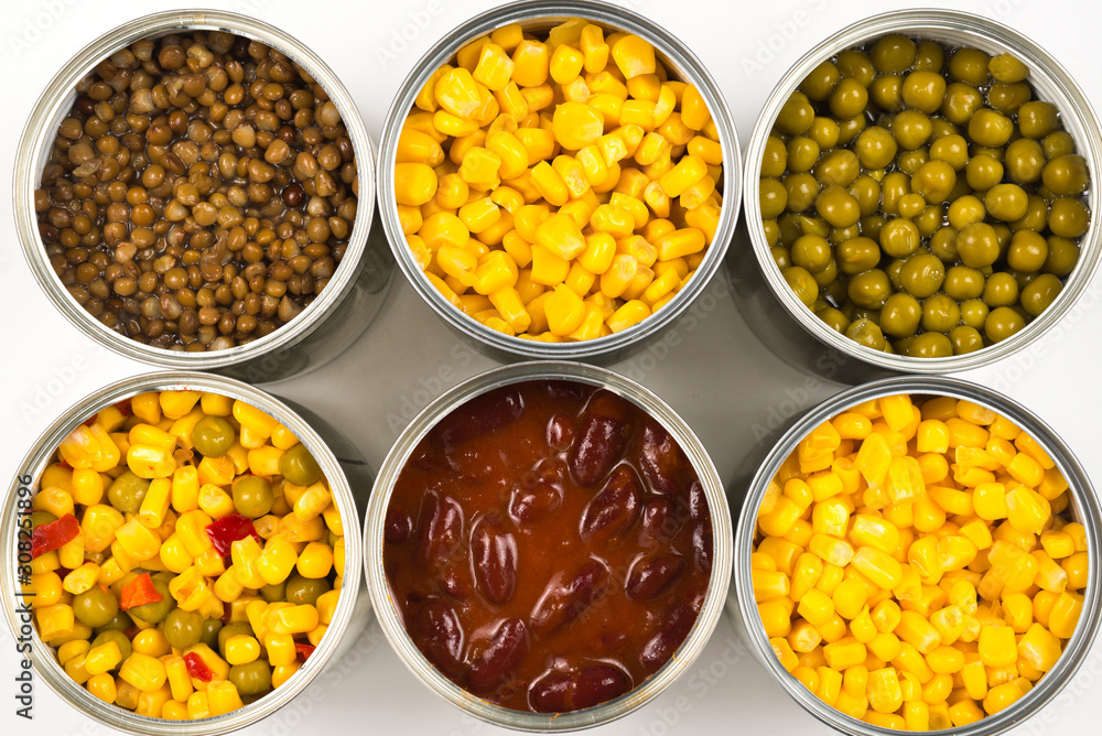 Canned food on white background. Green pea, beans, corn, lentils. Canned food on white background. Green pea, beans, corn, lentils.