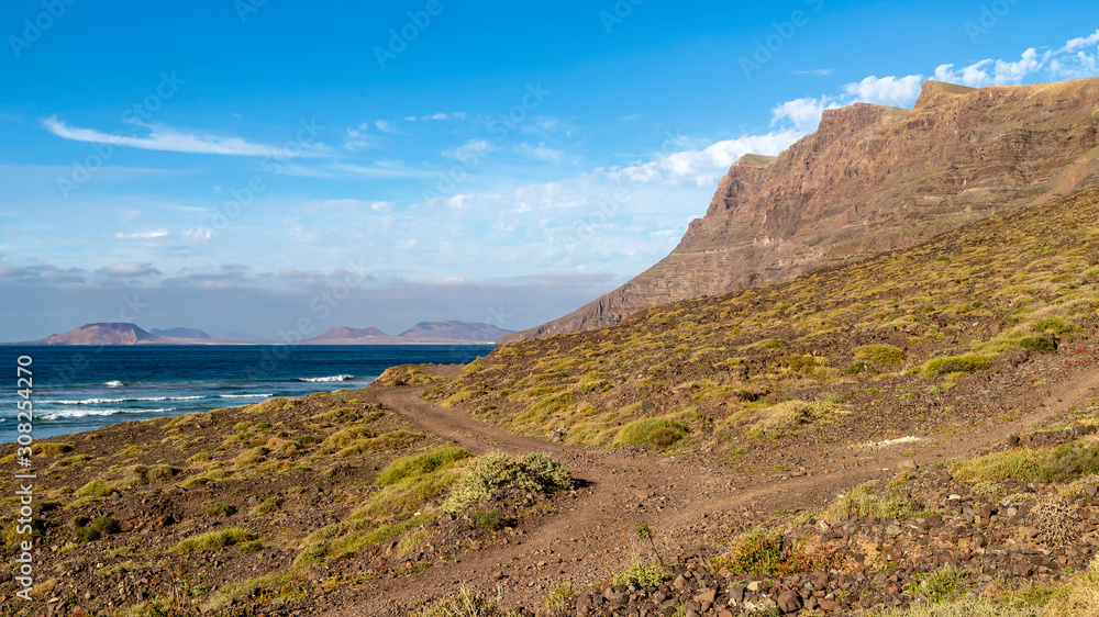 Beautiful view of Famara beach with La Graciosa island in the background, Lanzarote, Canary Islands, Spain