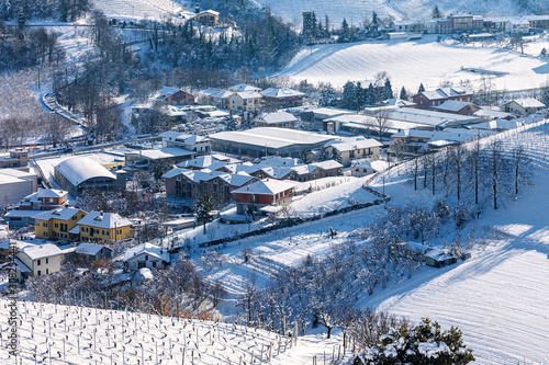 View from above on small town covered in snow in Italy.