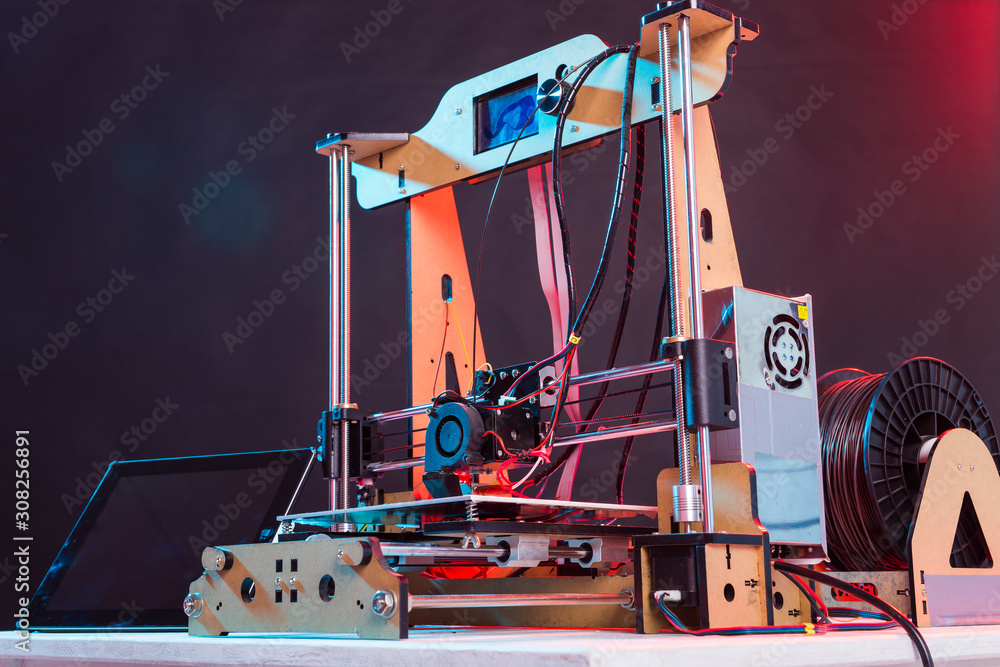 Electronic three dimensional plastic printer during work in laboratory, 3D printer, 3D printing