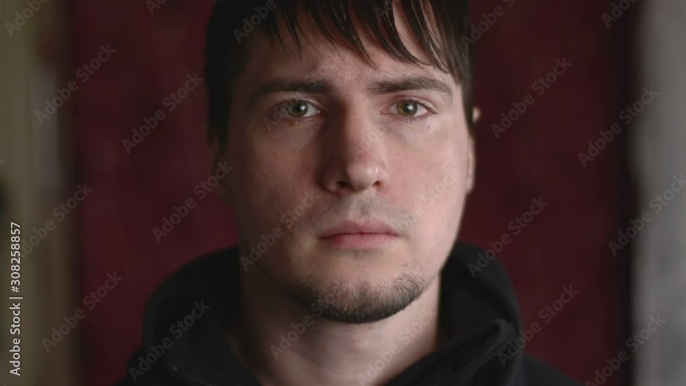 Close up emotional portrait of the young male staring angry, frowning and grumpy Close up emotional portrait of the young male staring angry, frowning and grumpy