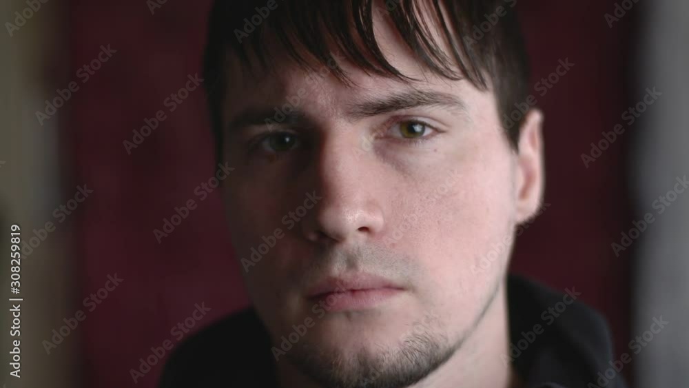 Close up emotional portrait of the young male staring frowning in suspicion, disagreement, doubt and lack of trust Close up emotional portrait of the young male staring frowning in suspicion, disagreement, doubt and lack of trust