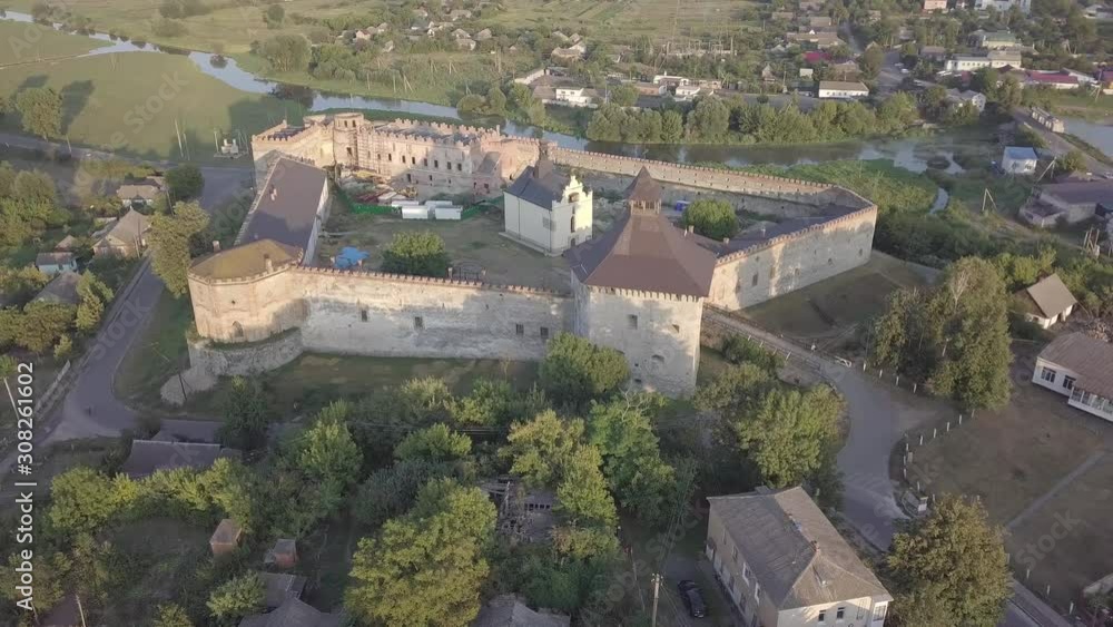 Aerial to Medzhybizh Castle and Church of St. Nicholas, one of the strongest fortres of the Crown of the Kingdom of Poland in Podolia. It is situated at confluence of Southern Bug rivers, Ukraine Aerial to Medzhybizh Castle and Church of St. Nicholas, one of the strongest fortres of the Crown of the Kingdom of Poland in Podolia. It is situated at confluence of Southern Bug rivers, Ukraine