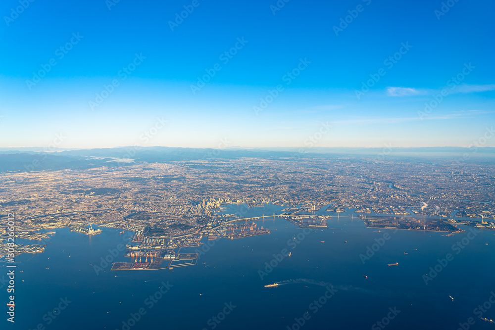 Aerial view of Yokohama City, Kawasaki city and Ota city in sunrise time with blue sky horizon background, Tokyo, Japan