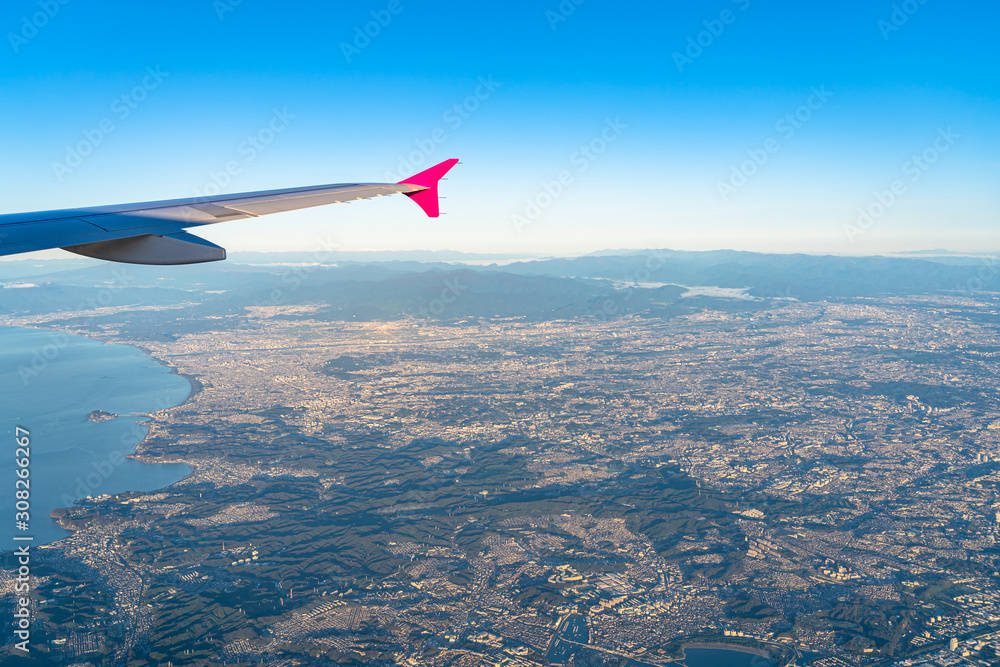 Fototapeta premium Aerial view of Shonan region in sunrise time with blue sky horizon background, Kanagawa Prefecture, Japan