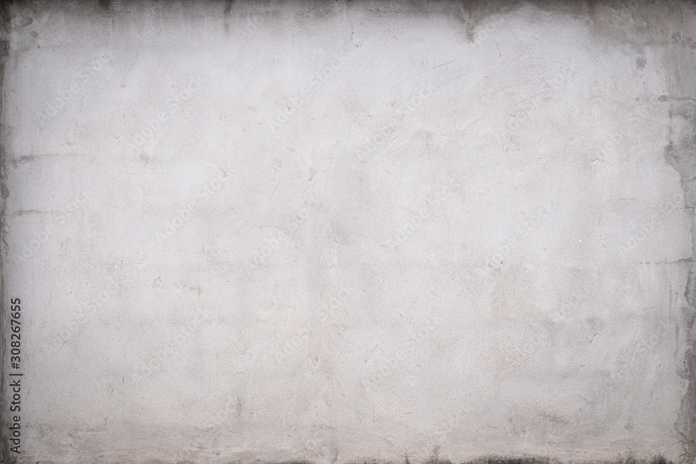 Fototapeta premium Gray concrete wall texture painted with white. The old white color that has been fading and peeling off. Texture of old dirty concrete wall for background.