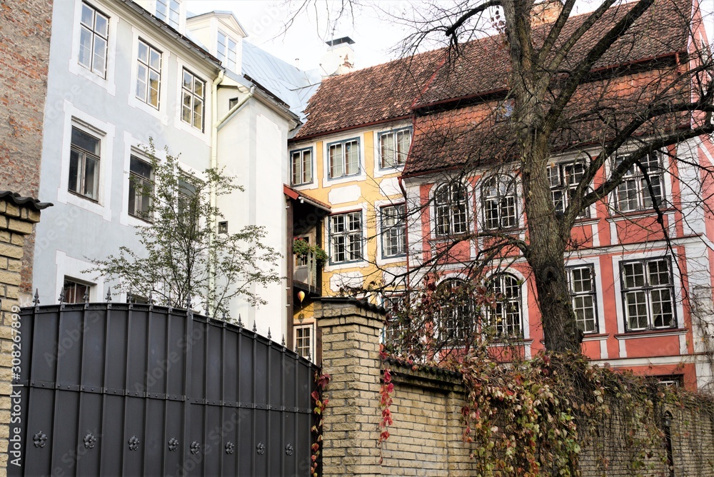 Fototapeta premium Riga, Latvia, November 2019. An enclosed courtyard on the corner of two beautiful old buildings.