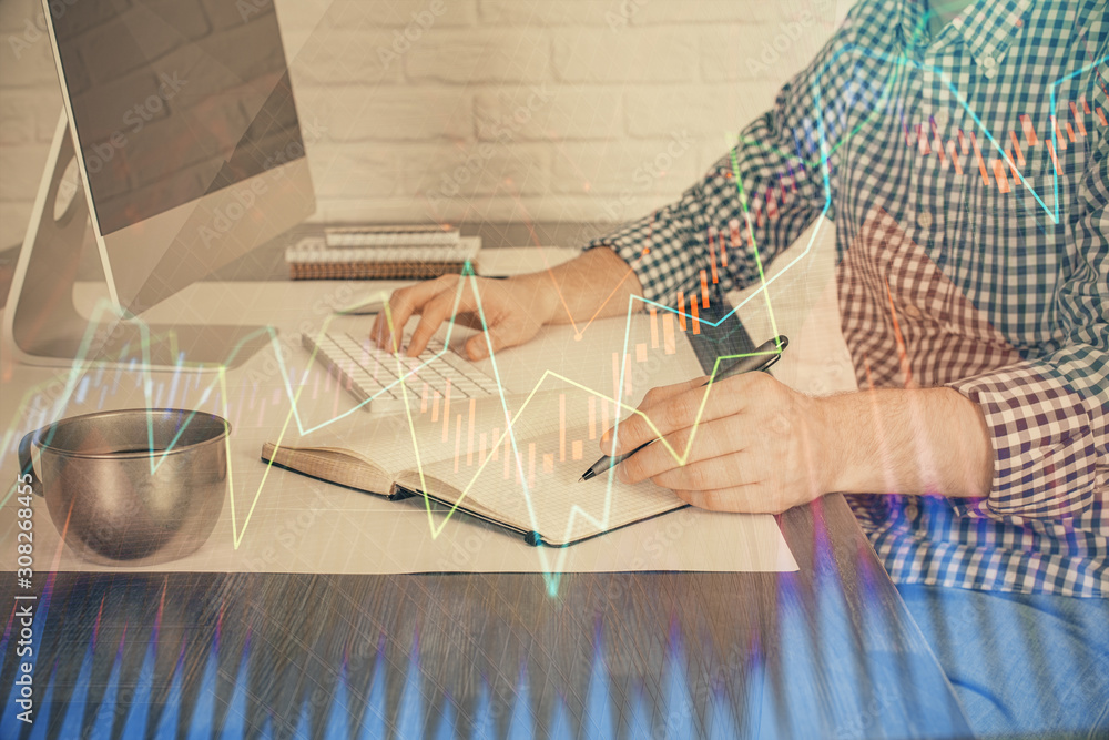 Double exposure of stock market chart with man working on computer on background. Concept of financial analysis. Double exposure of stock market chart with man working on computer on background. Concept of financial analysis.