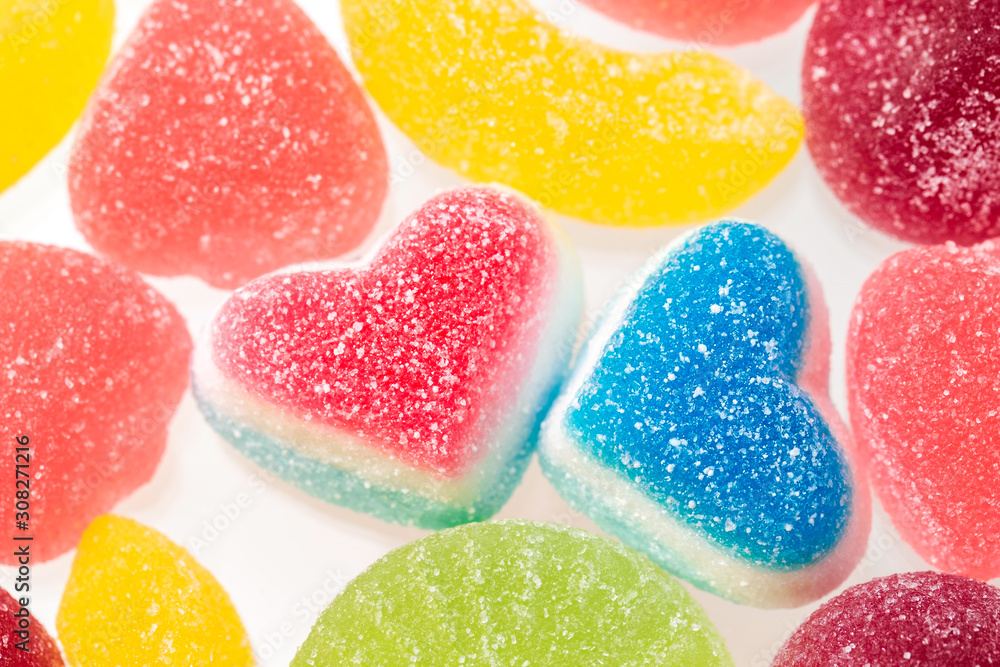 Delicious fruit jelly, heart shape candies, bright holiday sweets closeup Delicious fruit jelly, heart shape candies, bright holiday sweets closeup