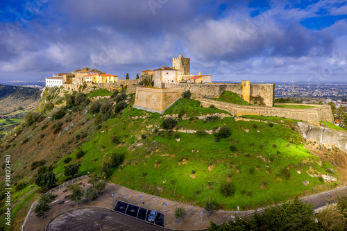 Aerial panorama view of Palmela castle pousada with stunning blue sky and old wind mills near Setubal Portugal