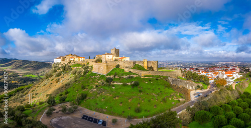 Aerial panorama view of Palmela castle pousada with stunning blue sky and old wind mills near Setubal Portugal photo