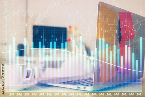 Forex market graph hologram and personal computer on background. Double exposure. Concept of investment.