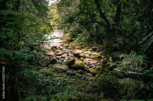 Big waterfall with river and rocks, inside rainforest, Rio de Janeiro, Brazil