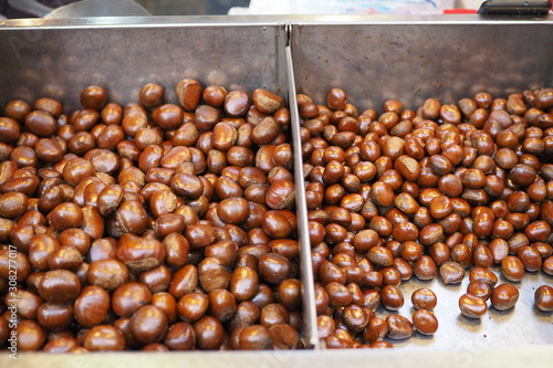 chestnuts roasted from a street vendor on the road in winter