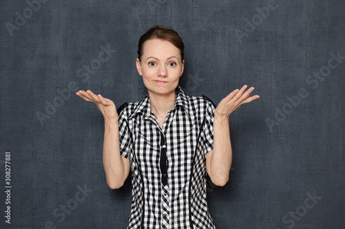 Portrait of upset bewildered girl not understanding what happened