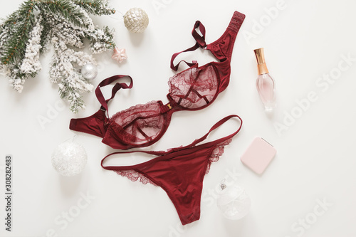 Fotografie Red lace lingerie and perfume bottle